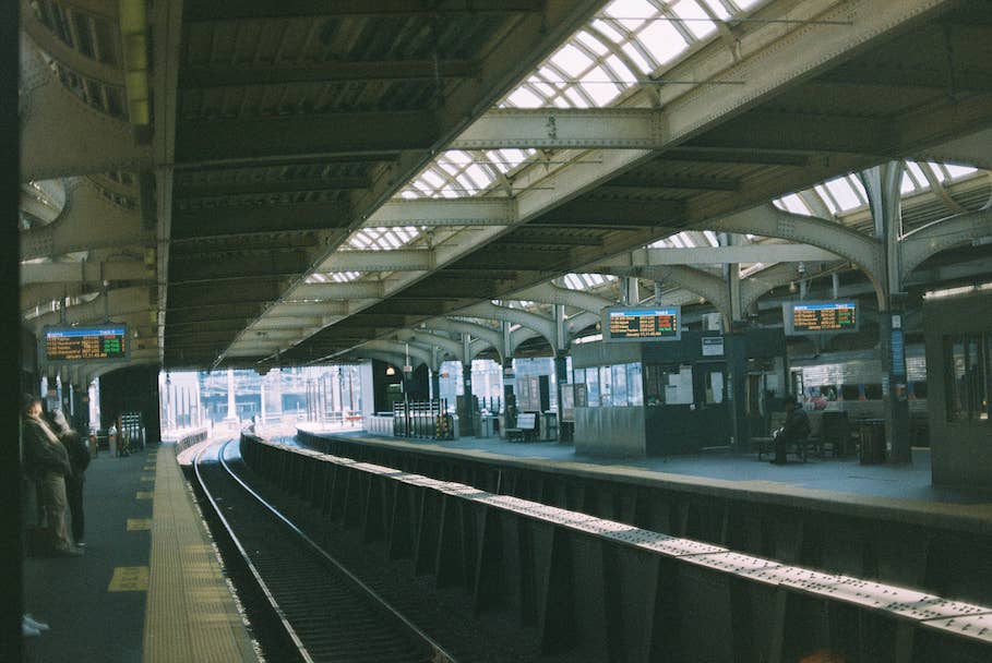 Large train station with multiple train tracks